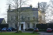 Bicester Manor House, a large, classical styled building with large windows