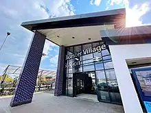 Photo of Bicester Village station, featuring a blue tiled atrium.