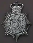 Hat badge of the type in use on the last day of the service