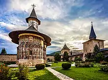 Sucevita church with painted walls inside a walled complex