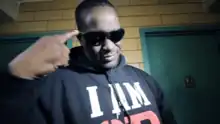 Screenshot of Blaq Poet from music video "Catch My Drift" by Ruc featuring Blaq Poet