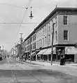 Bloom Brothers Chambersburg #1, 84 South Main Street (first store from right), 1897-1900 and 1900-1903, respectively (Postcard image)