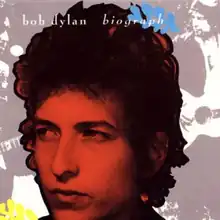 A red-tinted photograph of Dylan's face in profile