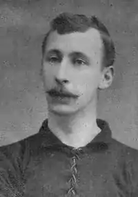 A man wearing a football shirt.