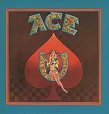 A painting of a woman seated inside of a horseshoe, superimposed over a red spade from a deck of cards with the word "ACE" written above