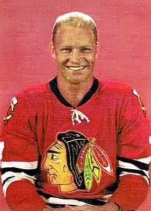 Crew cut: top, medium; back/sides, medium taper; sideburns, medium; short pomp (pompadour) front, flattened; mid top, rounded; crown, rounded; front hairline, average; curly hair. Bobby Hull.