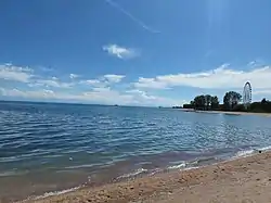 Beach "Tolkun" in Bosteri during sunny weather. June 2022.