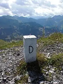 Same boundary marker on the other side. The "D" stands for "Deutschland", i.e. Germany in German.