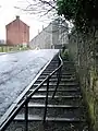 Steps and handrail for pedestrians at the steepest part of the hill