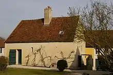 A small two-story farmhouse