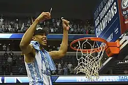 Image 2Brice Johnson cuts down the nets after winning the 2016 ACC tournament with North Carolina