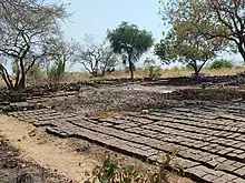 Refugees are laying Bricks for sale.