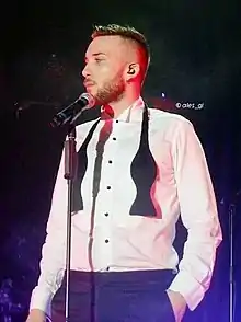 Briga performing at Never Again Live Tour in Rome (2015)