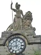 Sculpture of Britannia above a clock was added atop the Old Academy in Perth in 1886