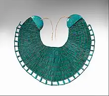 Broad collar of Wah; 1981–1975 BC; faience and linen thread; height: 34.5 cm, width: 39 cm; Metropolitan Museum of Art (New York City)