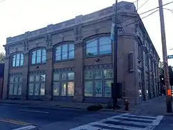 Image of a two-story brown brick square building