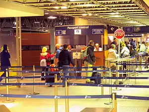 Juxtaposed immigration controls at Brussel-Zuid/Bruxelles-Midi railway station, with the Belgian Federal Police carrying out exit immigration checks from the Schengen Area in front, and the UK Border Force carrying UK entry immigration checks behind.