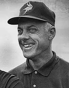 Bud Grant wearing a cap