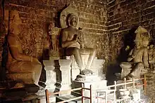 Seated Buddha Vairocana flanked by Avalokiteshvara and Vajrapani of Mendut temple, Central Java, Indonesia, early 9th century.