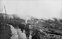 Photograph of I Battalion leaving the burning village of Gornji Turki, 5 April 1944