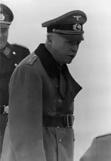 Upper body of Charles Edward with other men in German military uniform