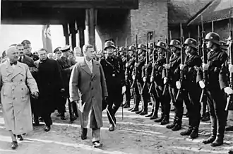 Black-and-white contemporary photograph of Windsor inspecting SS men