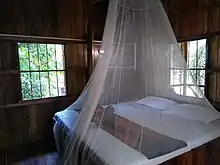 A net hanging over a bed