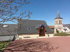 The town hall and church in Bussières