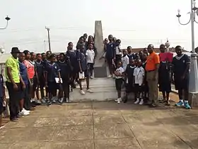 An obelisk surrounded by people