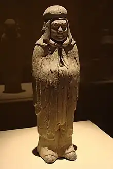 Male xianbei warrior wearing a cloak and xianbei hat, Northern Wei dynasty.