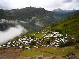 Awqa Urqu (in the background, on the right) as seen from Cochamarca (Quchamarka) in the southwest