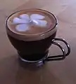 Double shot macchiato with a little foam, in glass, as served in Natick, Massachusetts