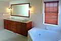 An apartment's bathroom in the historic Beach Club Residences apartment community