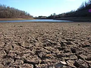 A dry lakebed in California, which is experiencing its worst megadrought in 1,200 years..mw-parser-output cite.citation{font-style:inherit;word-wrap:break-word}.mw-parser-output .citation q{quotes:"\"""\"""'""'"}.mw-parser-output .citation:target{background-color:rgba(0,127,255,0.133)}.mw-parser-output .id-lock-free a,.mw-parser-output .citation .cs1-lock-free a{background:url("//upload.wikimedia.org/wikipedia/commons/6/65/Lock-green.svg")right 0.1em center/9px no-repeat}.mw-parser-output .id-lock-limited a,.mw-parser-output .id-lock-registration a,.mw-parser-output .citation .cs1-lock-limited a,.mw-parser-output .citation .cs1-lock-registration a{background:url("//upload.wikimedia.org/wikipedia/commons/d/d6/Lock-gray-alt-2.svg")right 0.1em center/9px no-repeat}.mw-parser-output .id-lock-subscription a,.mw-parser-output .citation .cs1-lock-subscription a{background:url("//upload.wikimedia.org/wikipedia/commons/a/aa/Lock-red-alt-2.svg")right 0.1em center/9px no-repeat}.mw-parser-output .cs1-ws-icon a{background:url("//upload.wikimedia.org/wikipedia/commons/4/4c/Wikisource-logo.svg")right 0.1em center/12px no-repeat}.mw-parser-output .cs1-code{color:inherit;background:inherit;border:none;padding:inherit}.mw-parser-output .cs1-hidden-error{display:none;color:#d33}.mw-parser-output .cs1-visible-error{color:#d33}.mw-parser-output .cs1-maint{display:none;color:#3a3;margin-left:0.3em}.mw-parser-output .cs1-format{font-size:95%}.mw-parser-output .cs1-kern-left{padding-left:0.2em}.mw-parser-output .cs1-kern-right{padding-right:0.2em}.mw-parser-output .citation .mw-selflink{font-weight:inherit}Ivanova, Irina (June 2, 2022). "California is rationing water amid its worst drought in 1,200 years". CBS News.