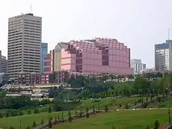 Large rose-colored office building with two stepped sections