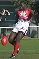 Canada's ruckman Manny Matata takes a kick against Sweden in round 2