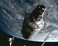 Canadarm2 moving the Harmony module into position on the ISS