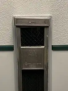 U.S. mail chute on an upper floor of the Fitzsimons Army Hospital. This chute would lead to a collection box on the ground floor.