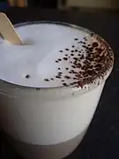 A cappuccino garnished with cocoa powder