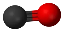 A carbon atom (shown as a grey ball) tripled bonded to an oxygen atom (shown as a red ball).