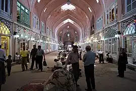 Covered arcade lined by shops.