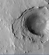 Crater in the middle of Cassini, as seen by HiRISE.  Layers may have been deposited under water since it is believed that Cassini once held a giant lake.