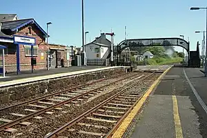 Photo down the length of the station showing the bridge over both tracks