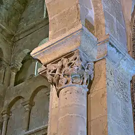 Corinthian capital decorated with anthropomorphic figures.