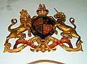 The Royal Coat of Arms given by King George V to replace an earlier set which were lost in a fire.  These arms hang above the west door.