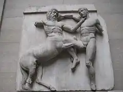 Sculpture of a fight between a man and a centaur.