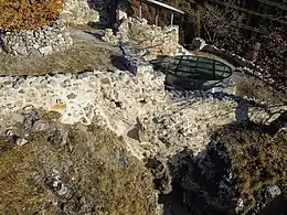 Remains of masonry overlooking a precipice.