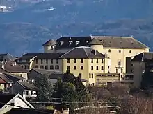 Photograph of a modern, rather un-warlike-looking, French château.