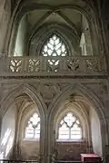 South chapel, with the chartrier in the upper section featuring a balustrade. The lower section features two pointed arches