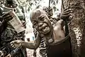 This child being weighed in a Mozambican village screams in fright. This image illustrates the desire for good health from both charms worn around the neck and use of the local health program on offer.